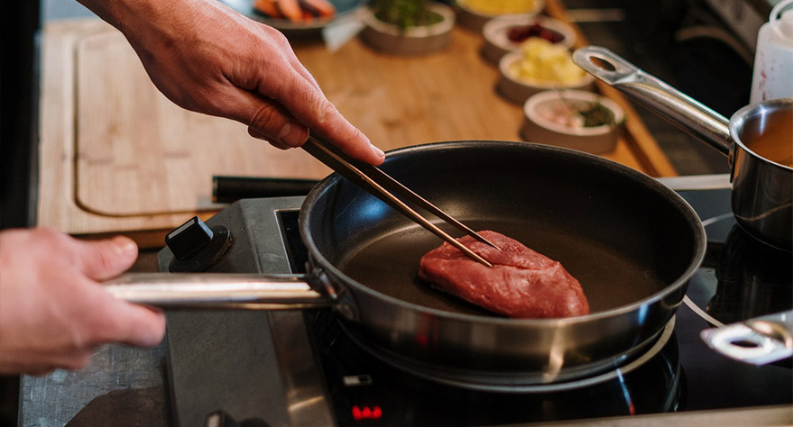 a que temperatura cocinar carne en horno electrico